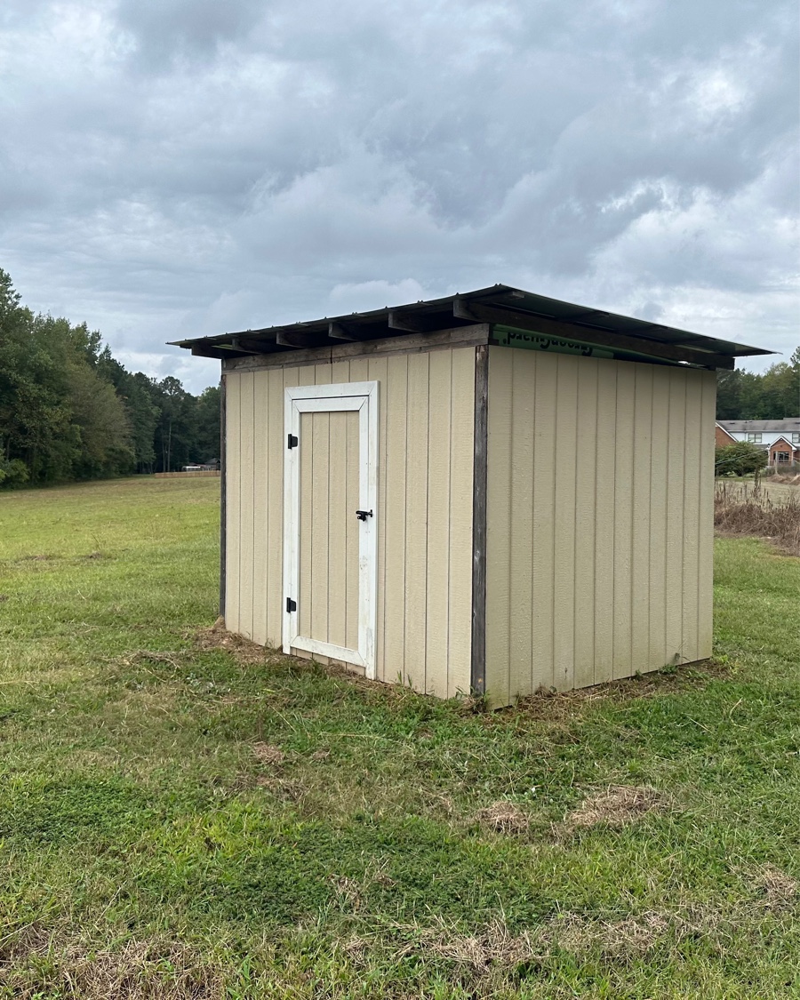 Gravel driveway repair project in Virginia Beach showing restored crown and proper drainage